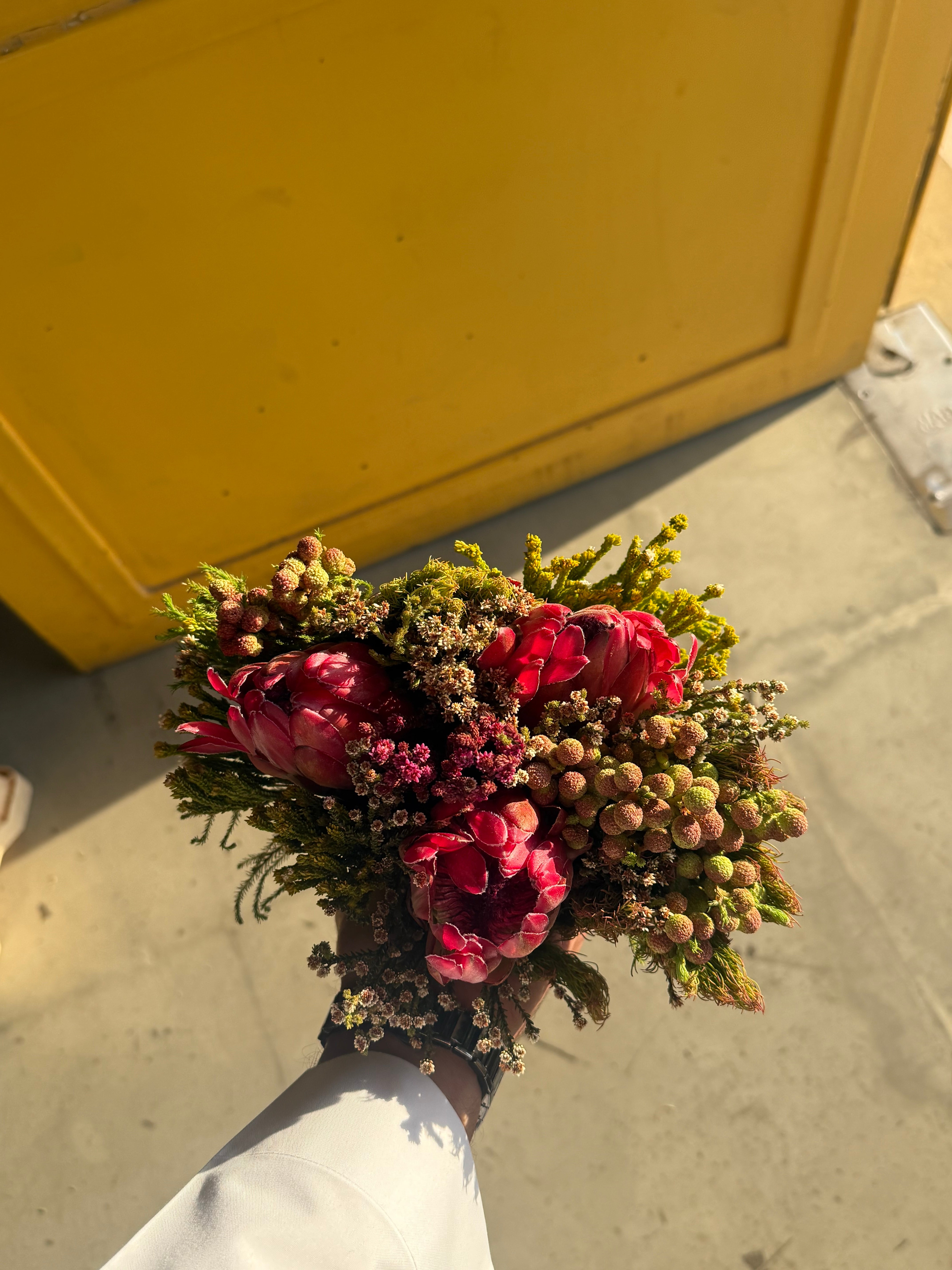 Three Protea Hybrid Carousel بوكيه