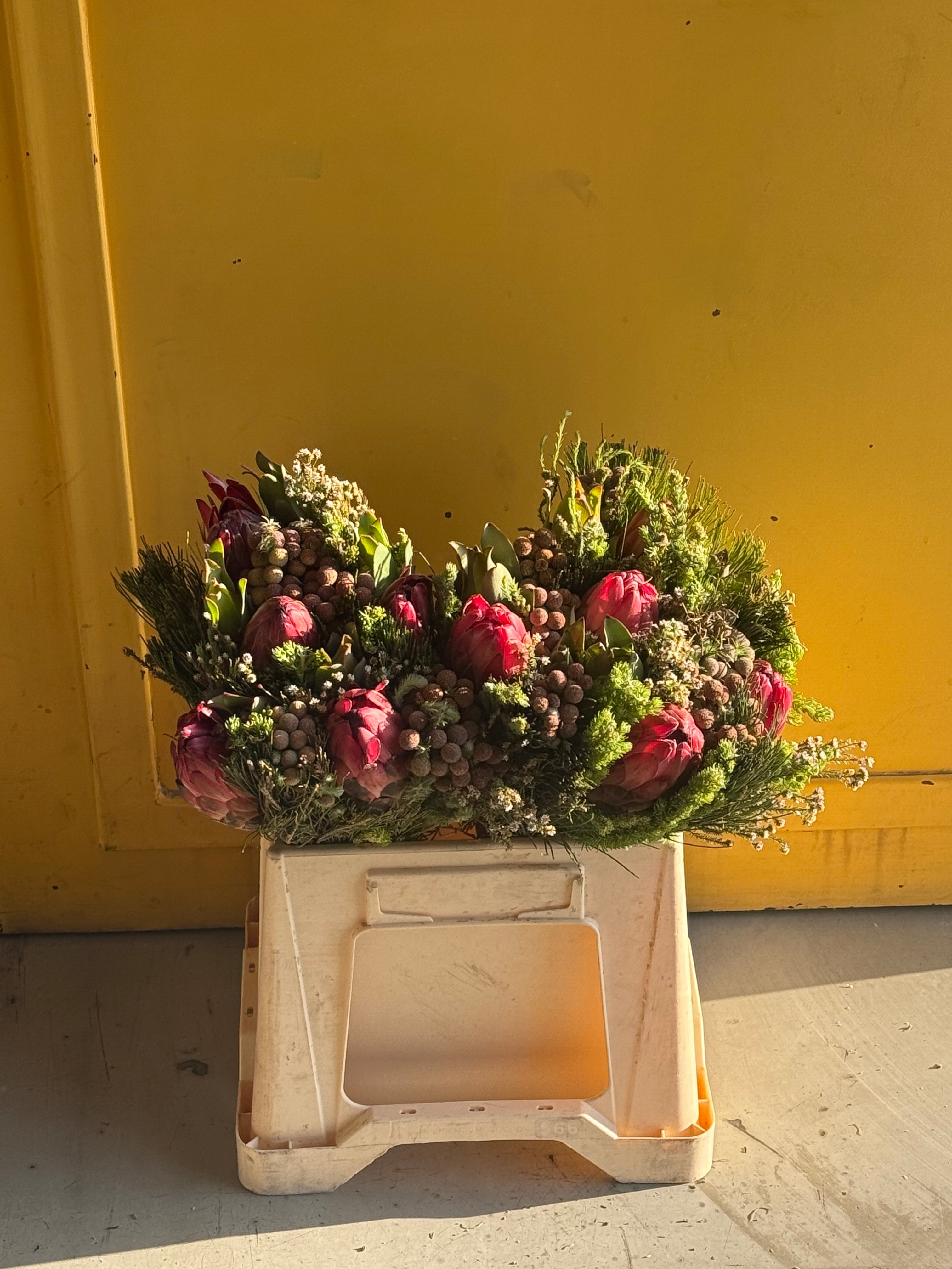 Three Protea Hybrid Carousel بوكيه